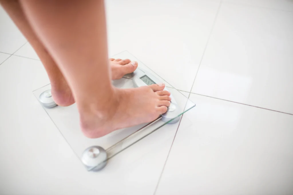 Digital scale used at weight loss doctor Houston for daily weight tracking and progress monitoring in wellness care.