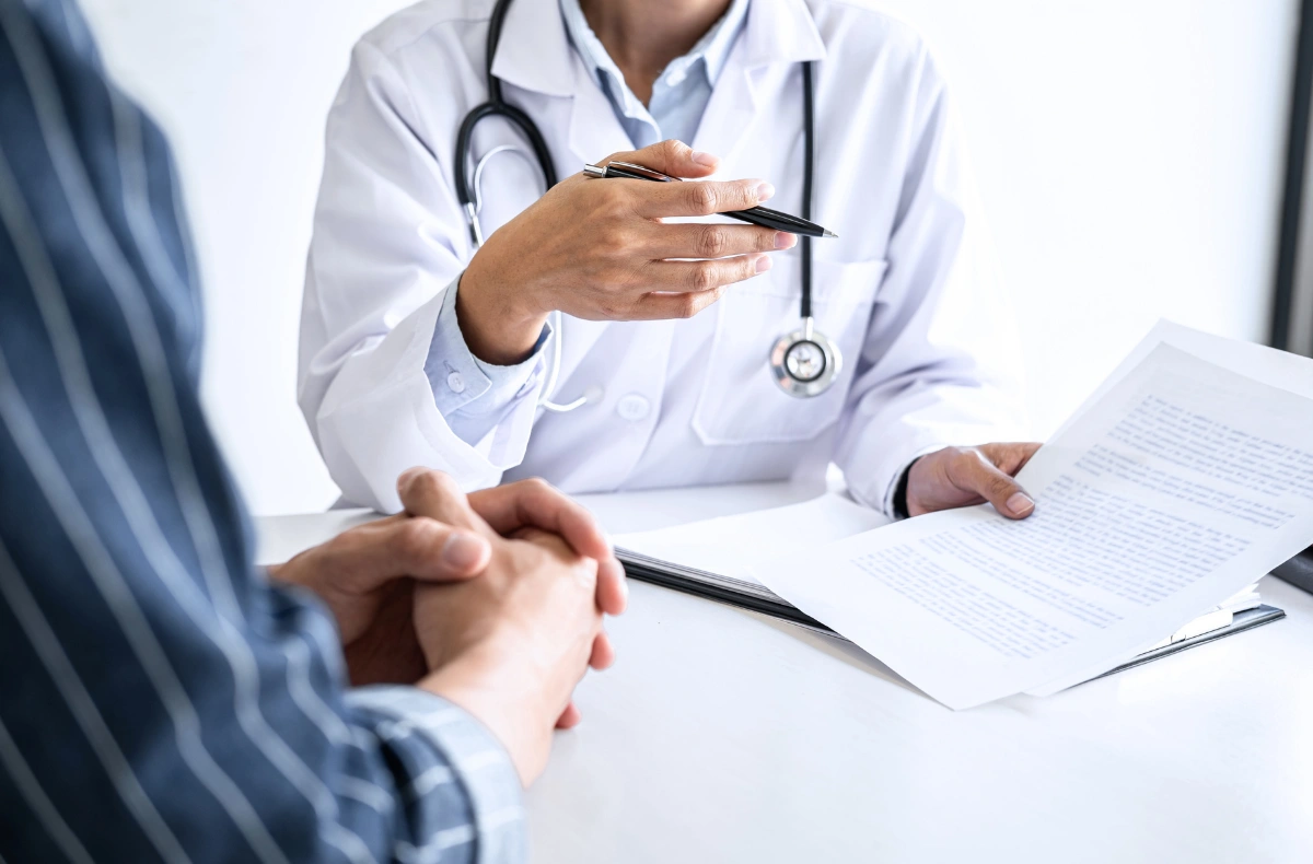 Doctor explains health plan at weight loss clinic Houston with personalized treatment options and patient-focused care.