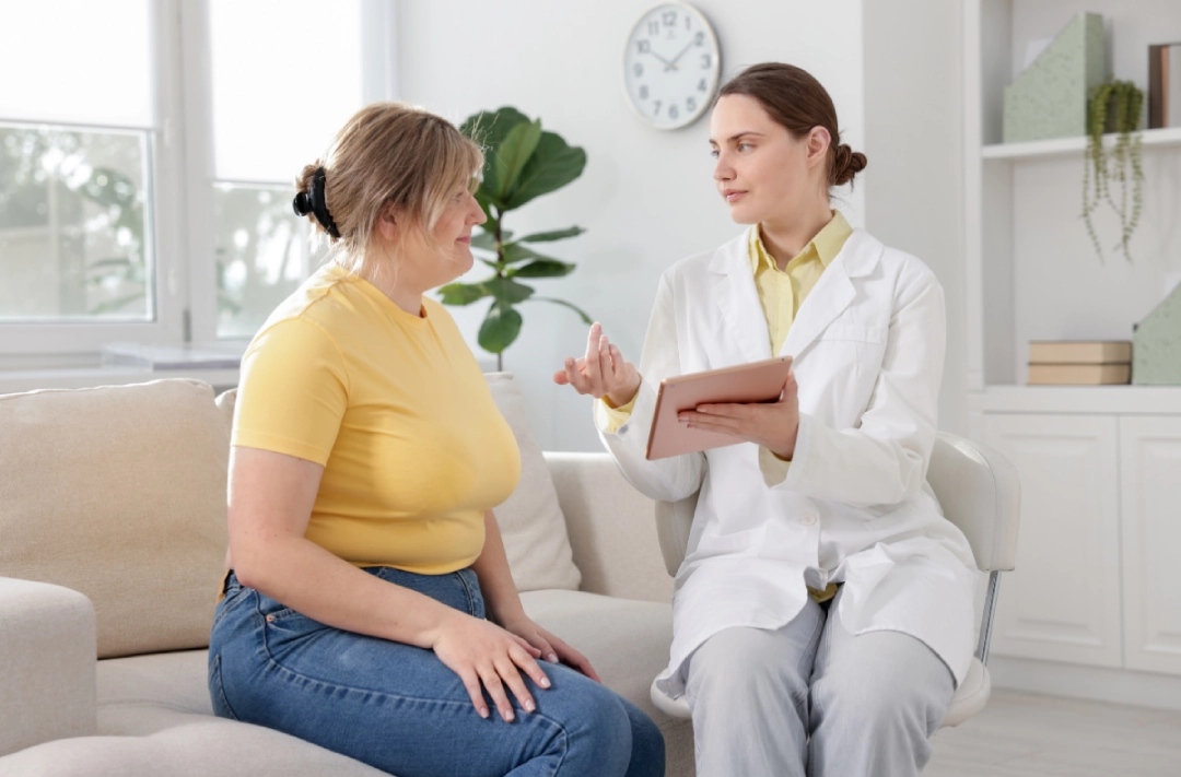 Prediabetes weight loss consultation with doctor explaining health plan in modern clinic with comfortable setting.