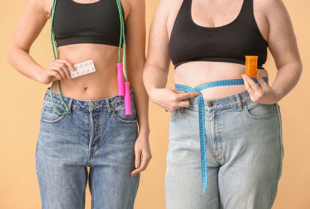 Slim and curvy women comparing waistlines with pills and tape, promoting Weight Loss Injections Houston results.