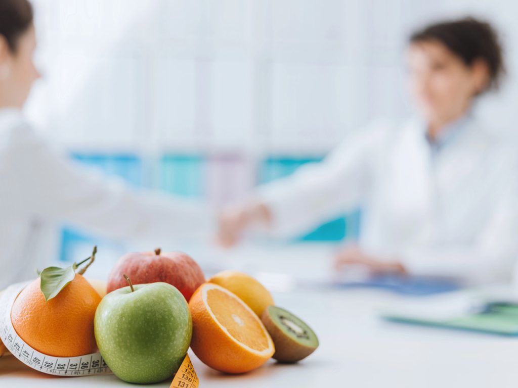 Fresh fruit on a desk during a professional nutrition consultation for patients starting Semaglutide Houston programs.