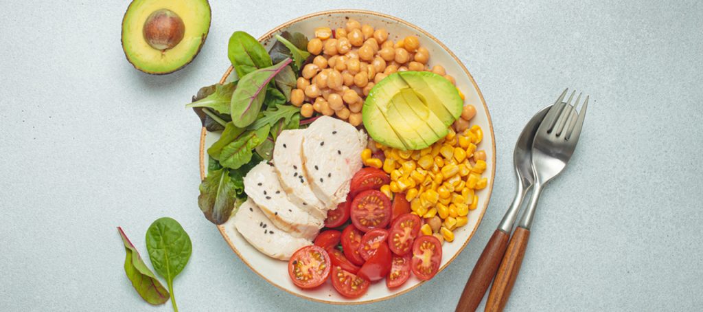 Nutritious meal prep bowl with chicken, avocado, and greens to complement a Semaglutide Houston medical weight loss plan.