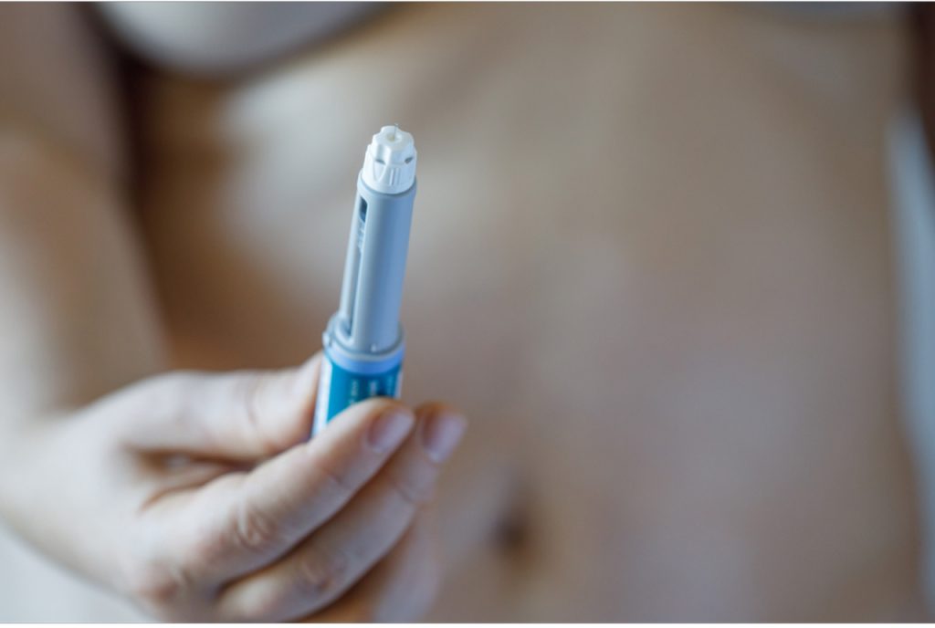Close up of a medical injection pen used for specialized treatments in the NewShape Weight Loss Clinic