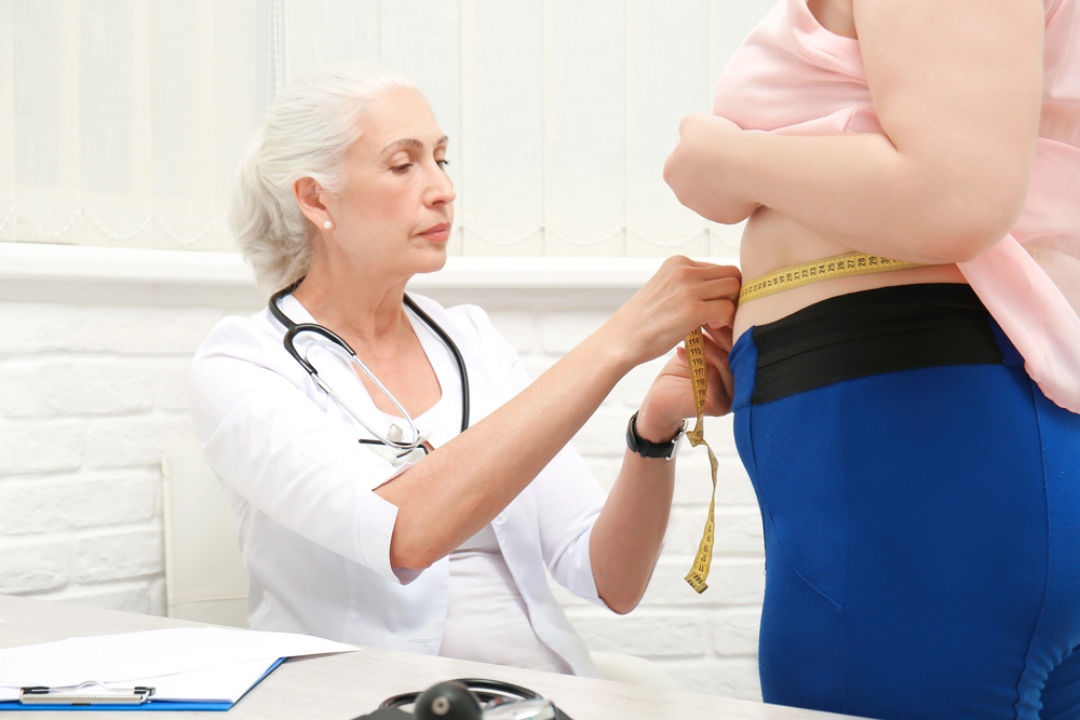 Medical professional measuring progress for a patient starting a program for weight loss injections Houston clinics offer.
